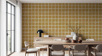 Mustard tiles vary slightly in shape across the Mid Century Wavy Grid wallpaper.