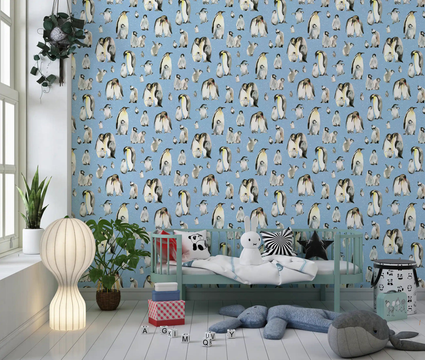 Pale blue ground sits behind every chick and adult on this Penguin Family wallpaper.