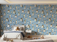 Adults huddle while chicks waddle across the Penguin Family wallpaper repeat.