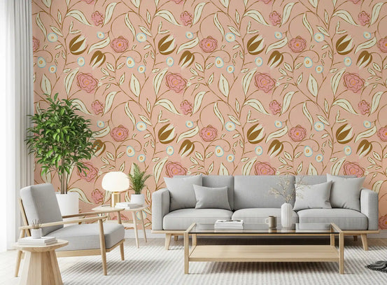 Blush pink chintz floral botanical wallpaper warms a relaxed living room scheme.