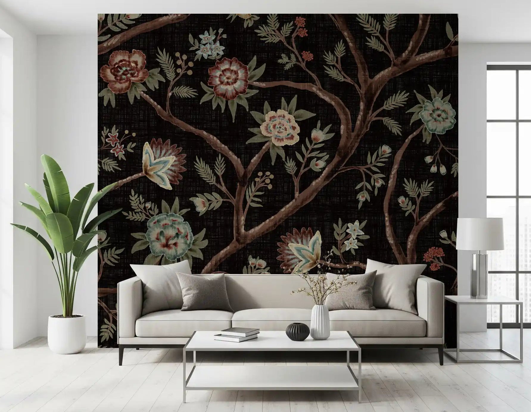 Dark chintz florals climb a living room scheme through the tree wall mural.