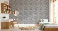 Gray-on-gray illustration warms a bedroom on this Vintage Tiger wallpaper backdrop.