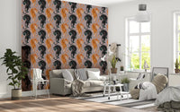 Painted tiger figures repeat in pairs over a mauve ground on this wallpaper.