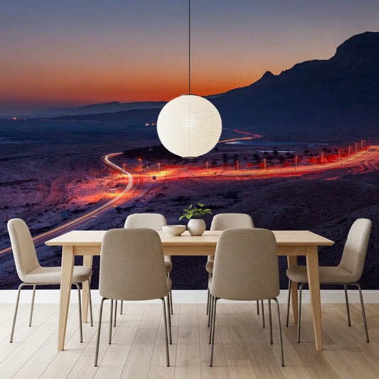 Sunset over a desert road and mountains behind a dining room wall mural GD11131
