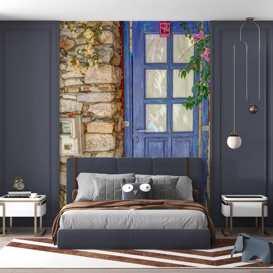 Pink bougainvillea trails beside a blue doorway on a bedroom wall mural GD11217

