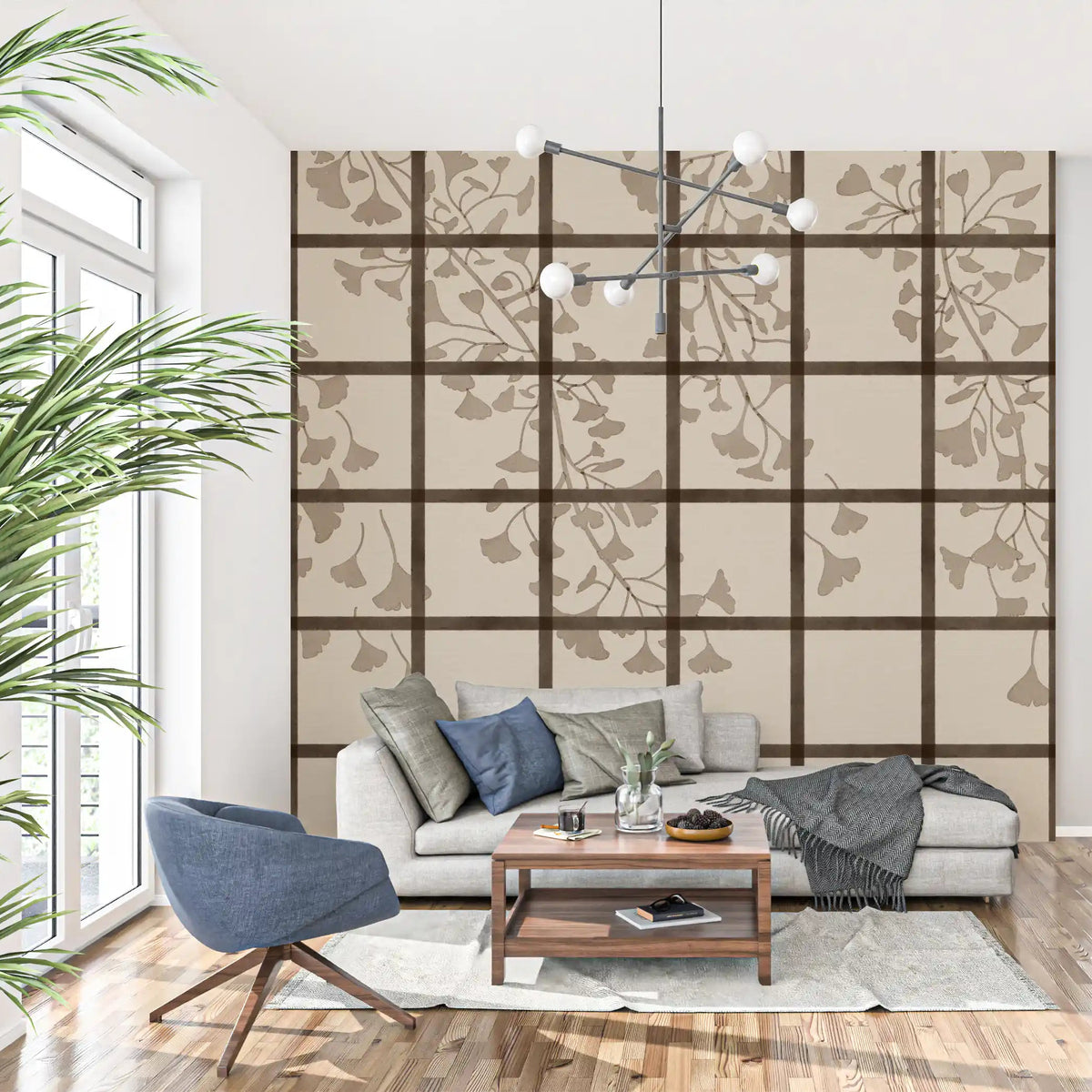 Shoji screen grid and ginkgo leaves on a wall mural across a living room GD11495