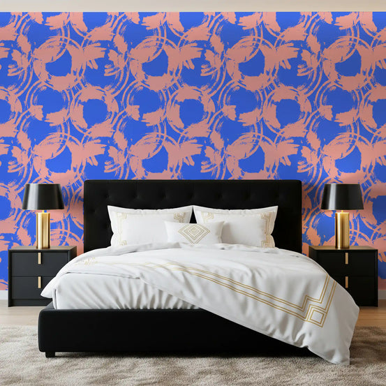 Abstract painted circles loop behind a bedroom in blue and pink wallpaper GD11591