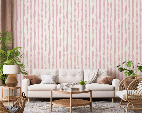 Painterly stripes wallpaper spreads down an open living room in blush GD11757
