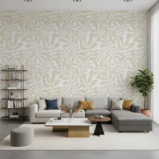 Muted beige leaf wallpaper spanning a calm living room feature GD11974