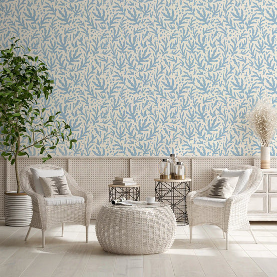 Blue seaweed pattern wallpaper sets a breezy living room backdrop on cream GD11991