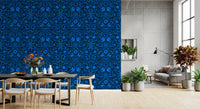 Blue folk art wall in a dining room with a black table and wood chairs GD12263