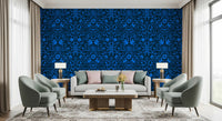 Cobalt folk art wallpaper behind two sage armchairs with blush pillows GD12263