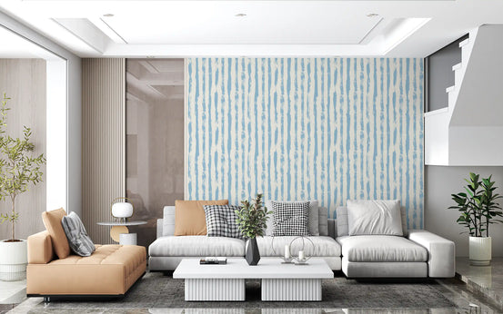 Azure brushstroke stripes wallpaper in an open plan living room with a tan and grey sectional GD12270