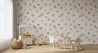 Sage and gold meadow wallpaper in a play area with a market stall and bunny chairs GD12281