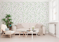 Green leaf wallpaper in a living room with a cream sofa and rattan chair GD12282