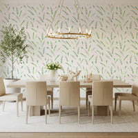Green leaf wallpaper in a dining room with a long table and potted olive tree GD12282