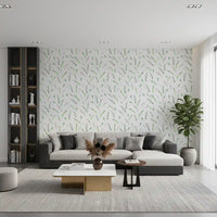 Green leaf wallpaper in a living room with a grey sofa and tall bookshelf GD12282