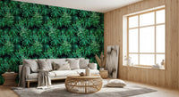 Tropical palm canopy wallpaper in a cosy reading corner with a cream armchair and rattan table GD12296