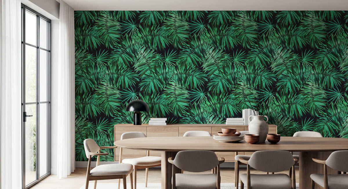 Dark green palm canopy wallpaper behind a round wooden dining table and beige chairs GD12296