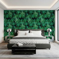 Dark green tropical palm wallpaper behind a black leather bed with white bedding GD12296