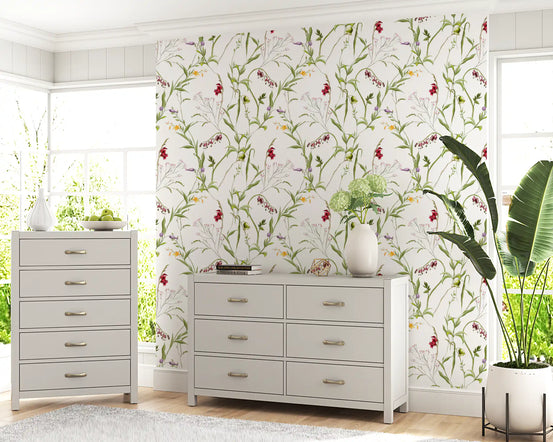 Wildflower meadow wallpaper in a bedroom with white dresser and tall chest of drawers GD12301