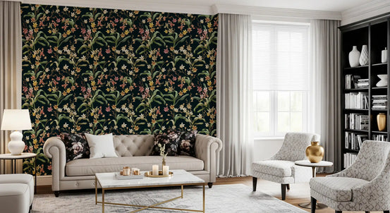 Midnight botanical orchard wallpaper in a living room with a cream tufted sofa and bookshelf GD12309