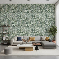 Grey sectional with ochre cushions against green eucalyptus brushstroke wallpaper GD12324