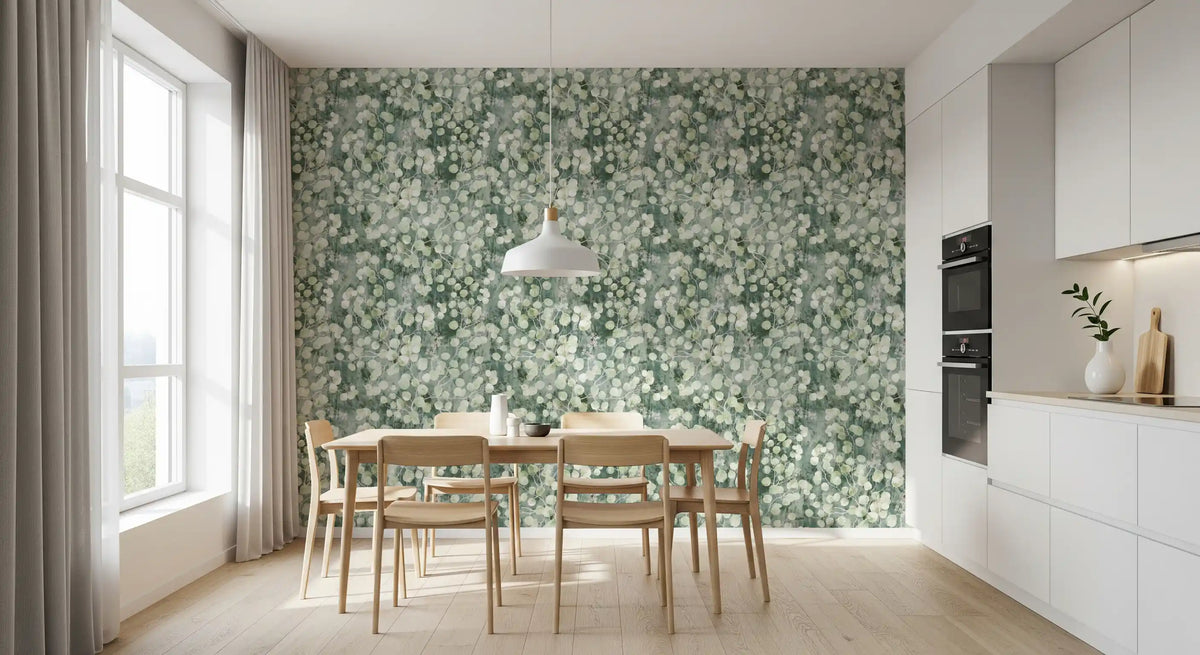 Bright dining nook with light wood table and chairs against eucalyptus brushstroke wallpaper GD12324