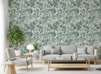 Grey sofa and armchairs with leafy plant against misty forest leaf canopy wallpaper GD12325