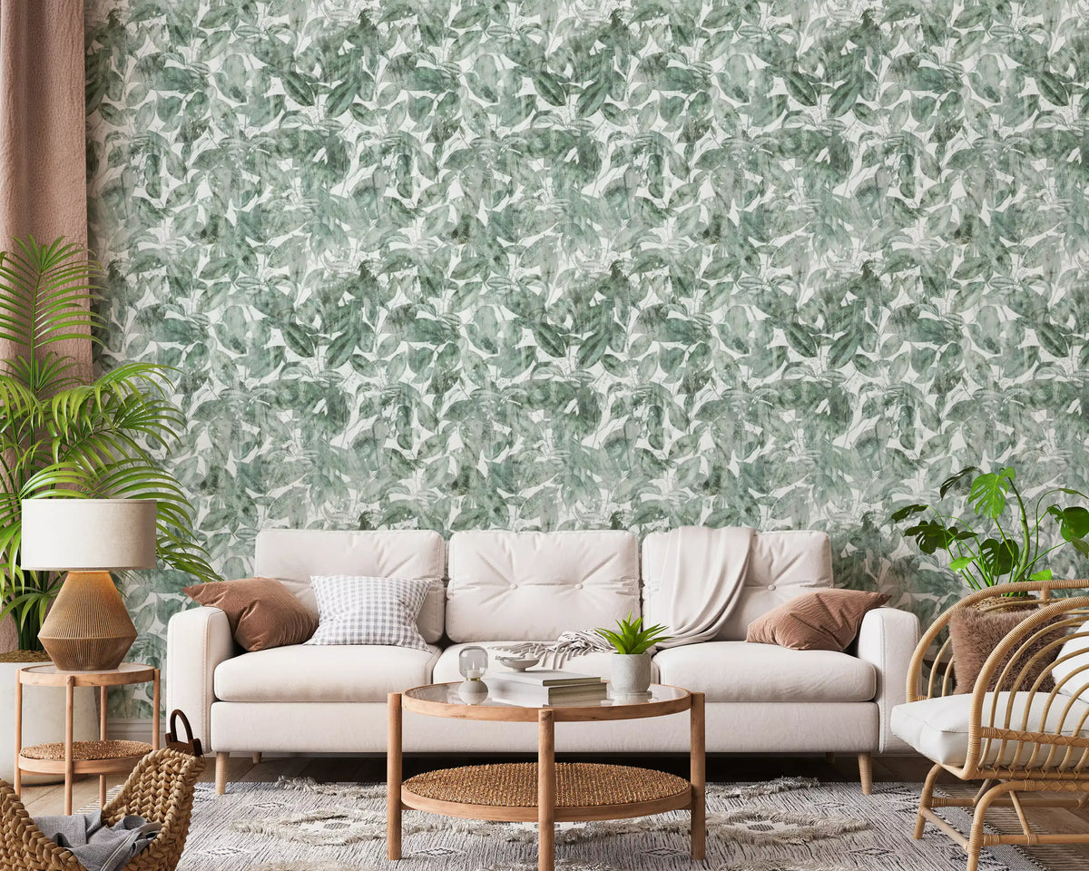 Cream sofa and rattan chair with plants against misty forest leaf wallpaper GD12325