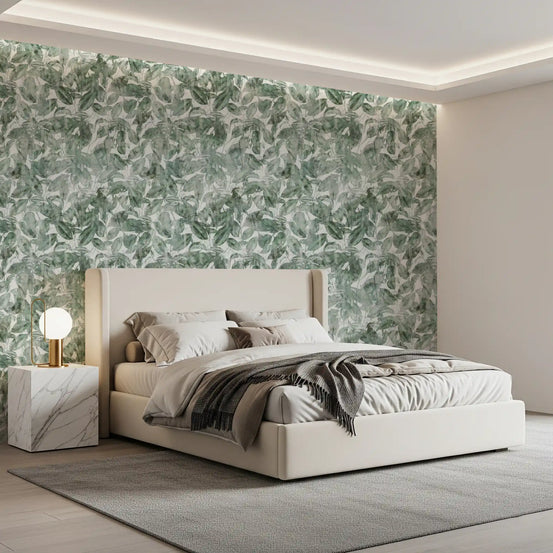 Cream upholstered bed and marble nightstand against misty forest leaf canopy wallpaper GD12325