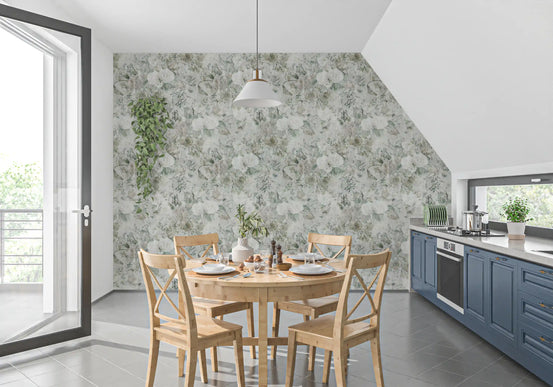 Misty botanical meadow wallpaper in a dining nook with blue cabinets and a round wood table GD12329