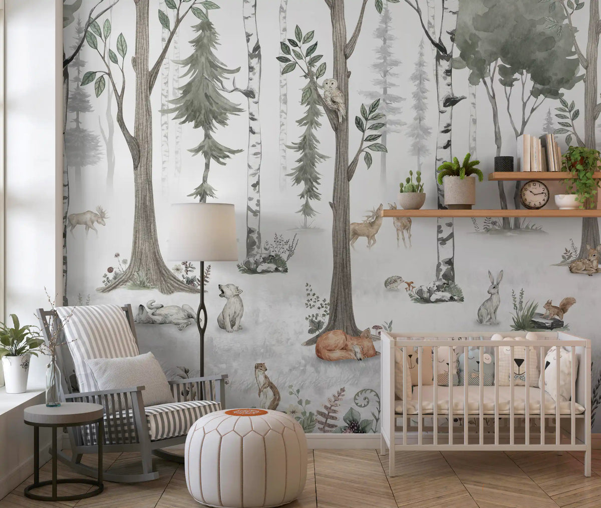 Green birch forest mural in a nursery with a white crib, grey armchair and floor lamp GD12401