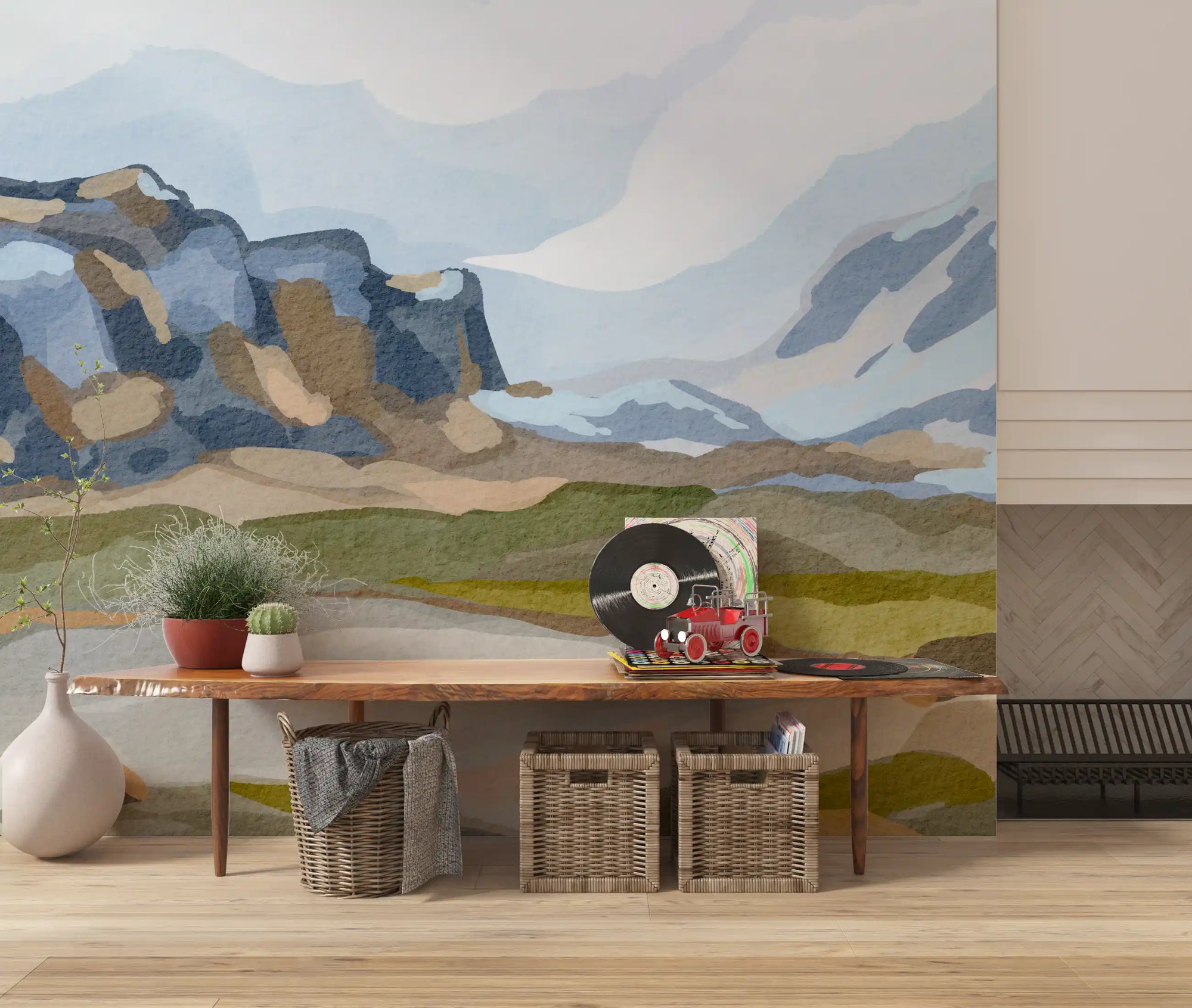 Watercolour mountain landscape wall mural behind a wood console with a vinyl player and baskets GD12403