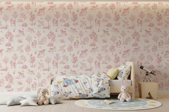 Blush unicorn wallpaper behind a wooden bed with rocket bedding and a telescope GD12411