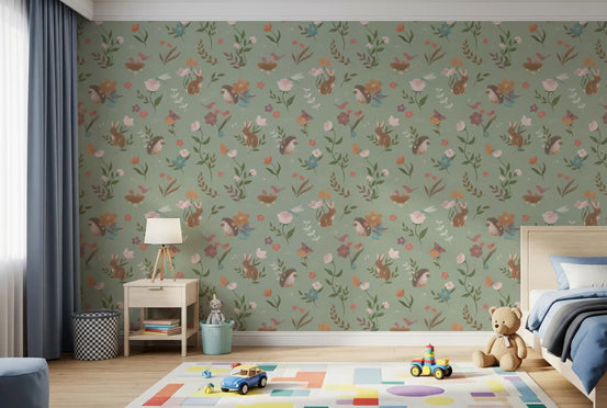 Sage green woodland wallpaper in a kids room with a blue bed and a block play rug GD12413