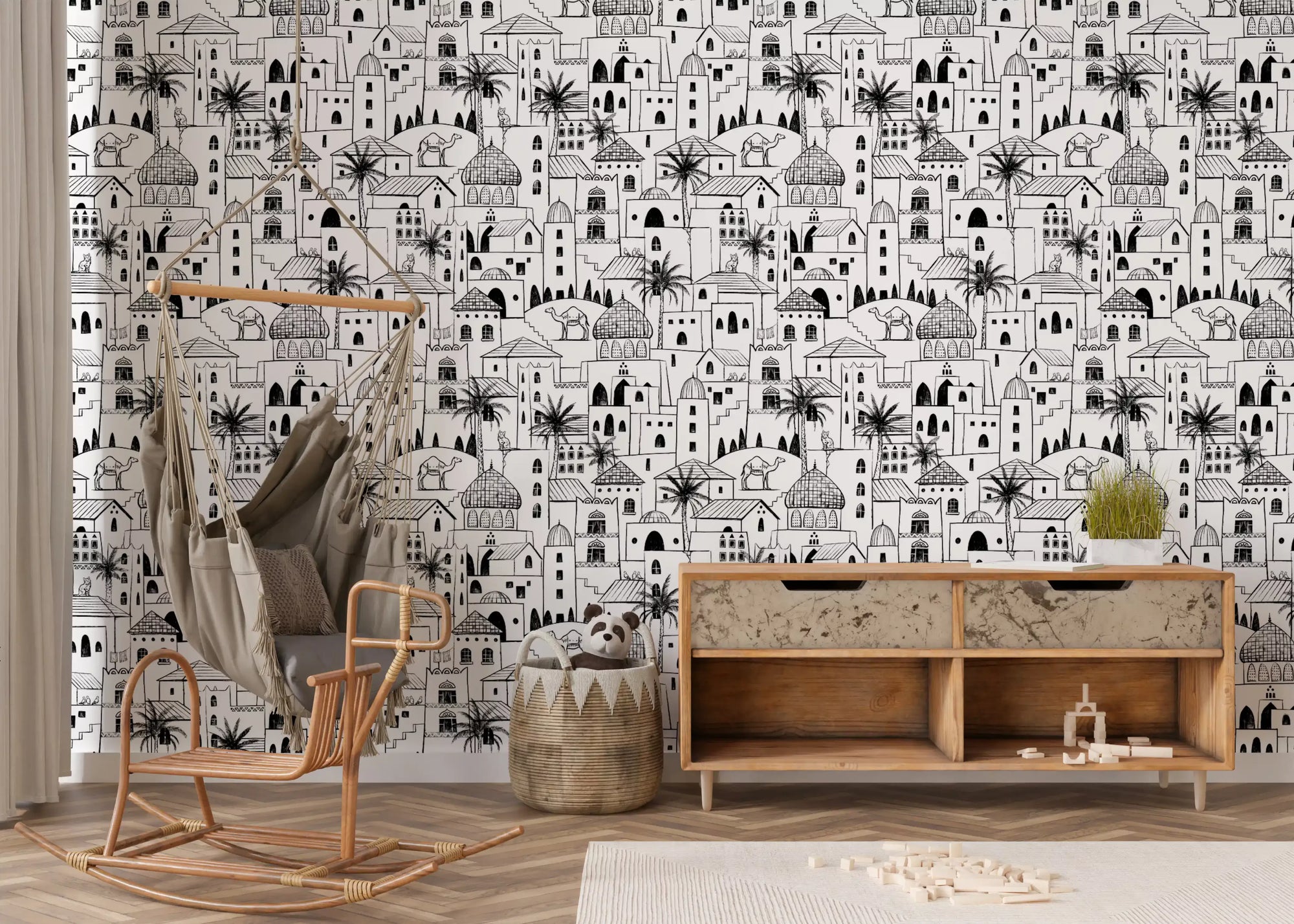 Middle Eastern desert town sketch wallpaper in a playroom with a rattan rocker and wooden sideboard GD12416