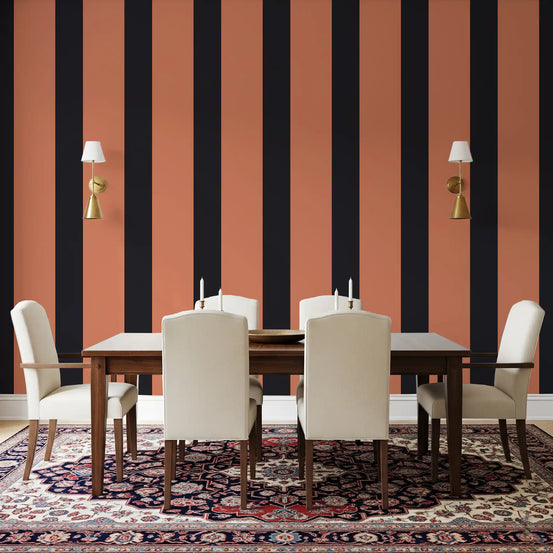 Burnt orange and charcoal stripe wallpaper in a dining room with cream chairs and a Persian rug GD12439