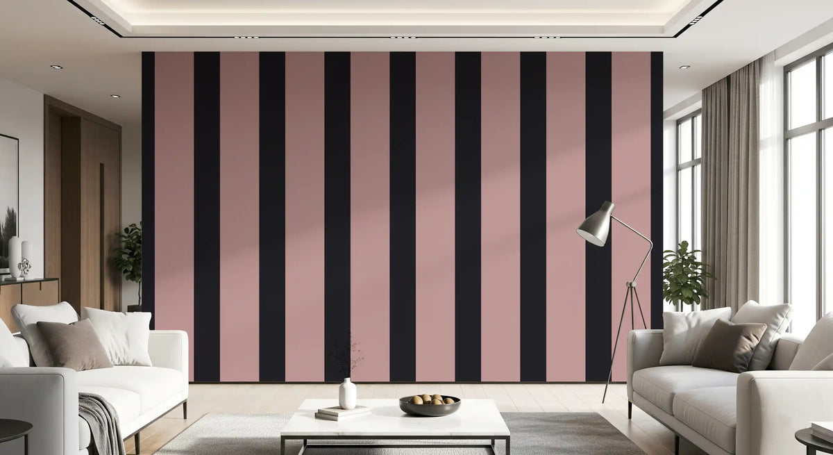 Charcoal and dusky pink stripe wallpaper in a bright living room with cream sofas GD12441