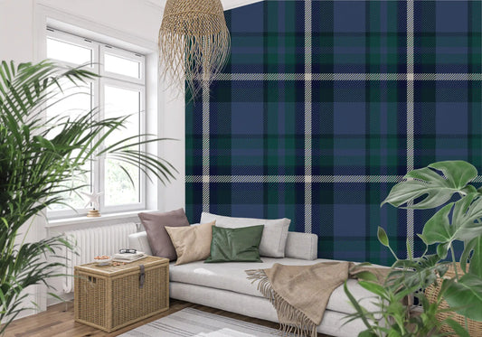 Heritage tartan wallpaper behind a cream sofa framed by leafy monstera plants GD12454
