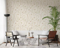 Cream geometric path wallpaper behind a white sofa with palms and a leather chair GD12457