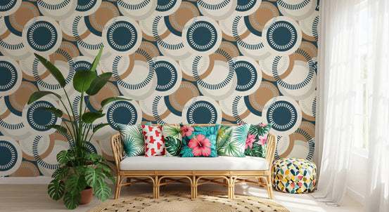 Modernist circular mosaic wallpaper behind a rattan chair with tropical floral cushions and monstera GD12461