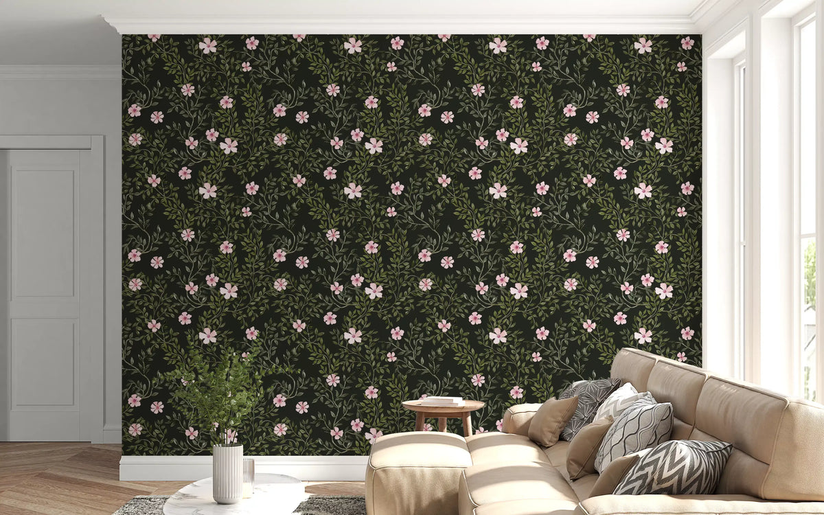Charcoal floral vine wallpaper behind a cream sectional with a small potted plant GD12467