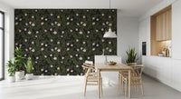 Charcoal floral wallpaper in a bright kitchen dining nook with a light wood table GD12467