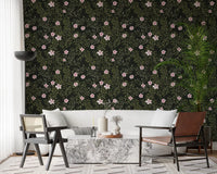 Dark floral wallpaper framing a white sofa with cane armchairs and a marble coffee table GD12467