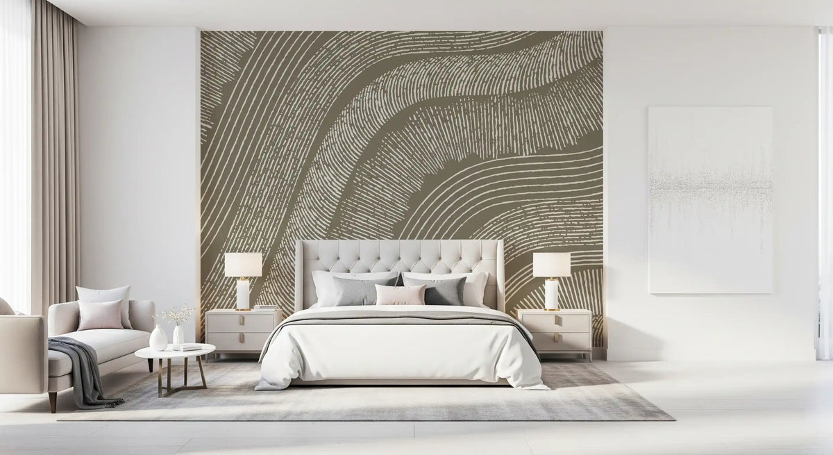 Taupe wavy lines mural behind a tufted cream bed with bedside lamps and a bench GD12471