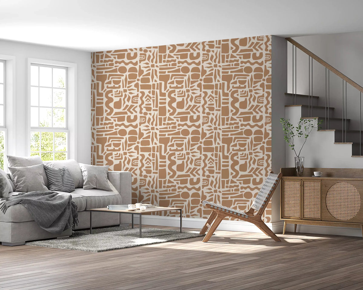Abstract earth toned shapes wallpaper by a staircase with grey sofa and cane chair GD12478