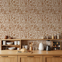 Earth toned shapes wallpaper in a kitchen with wood cabinets and dishware GD12478