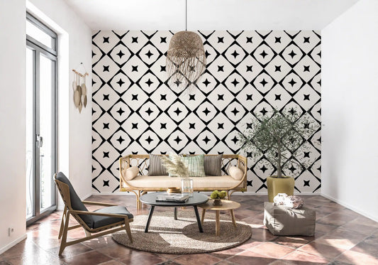 Black and white star grid wallpaper in a boho room with a lounge chair and terracotta floor GD12482