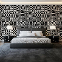 Black and white abstract grid wallpaper above a grey platform bed GD12488